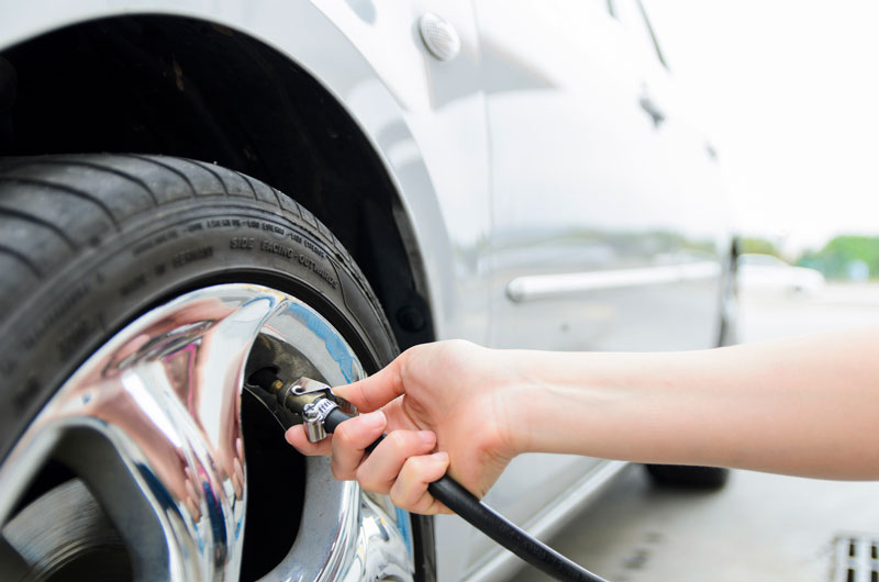 How do you determine the correct tire pressure for a truck?